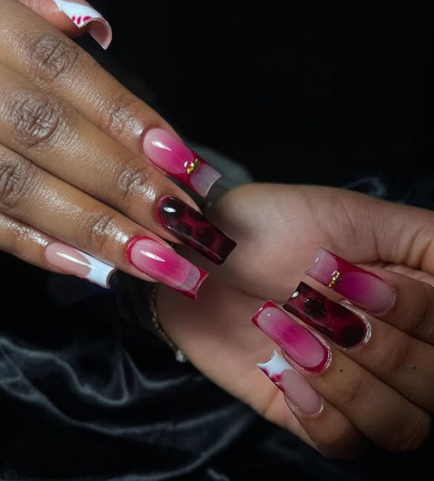 Long square nail extensions with pink and black ombre art.