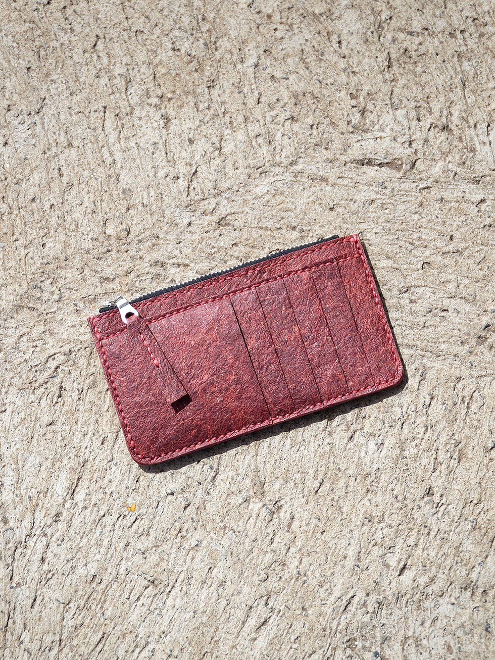 Overhead view of a dark red sustainable malai coconut leather wallet