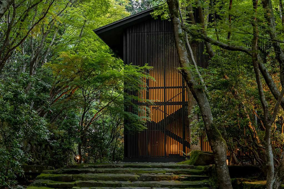 Aman Kyoto luxury resort set within a forested garden estate in Kyoto, Japan, featuring minimalist architecture, moss covered pathways, and serene natural surroundings
