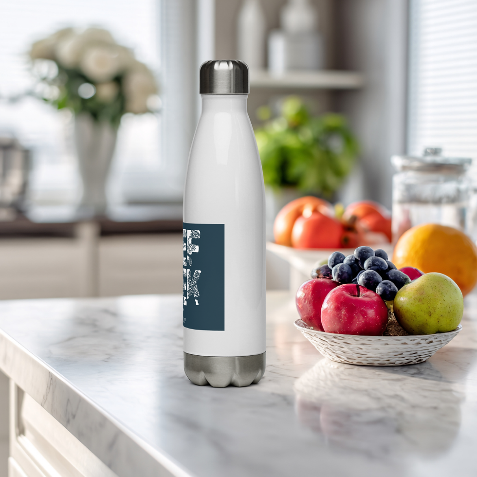 Thumbnail: Right side view of a stainless steel water bottle with reef geek written in coral, sitting on a kitchen counter.