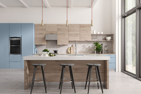 Modern kitchen with light wood accents and three bar stools