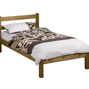 Pine single bed frame with brown patterned bedding