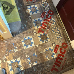 Damaged mosaic floor during restoration work.