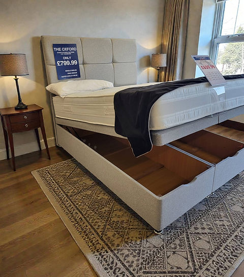 A bed with built-in drawers underneath for additional storage space