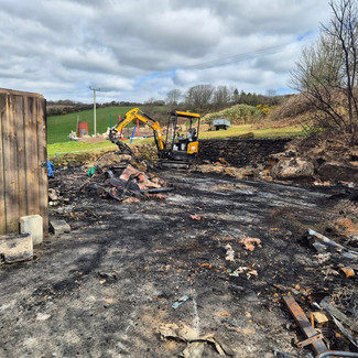 Demolition waste scattered across cleared land
