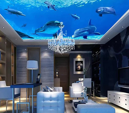 A spacious living room featuring a large aquarium and an elegant chandelier hanging from the ceiling