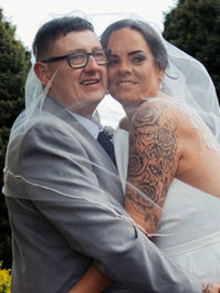 Bride and guest embracing