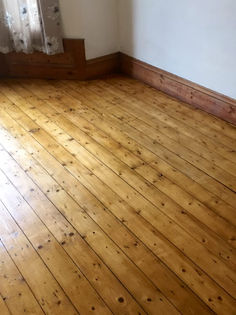Restored traditional solid wood flooring planks with a polished natural finish