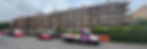 Wallace scaffolding ltd truck parked outside a large residential block covered in scaffolding