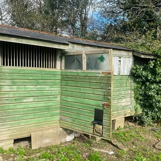 Timber shed before removal