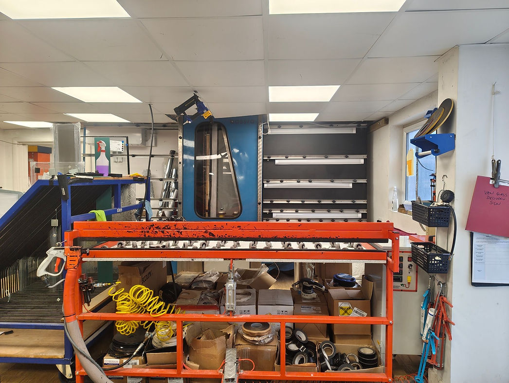 A cluttered workshop with tools and materials