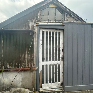 Timber shed with old door