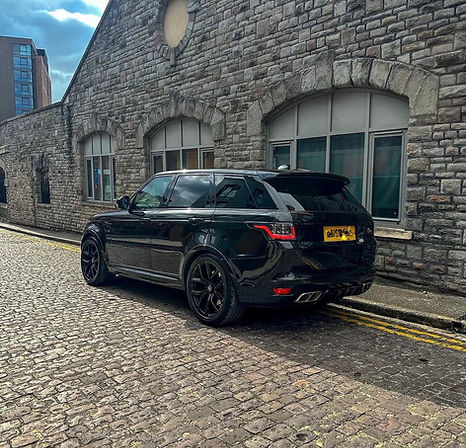 Side profile of black Range Rover SVR hire vehicle