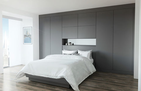 Minimalist grey fitted wardrobe with a central decorative recess