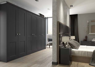 Modern bedroom featuring a dark grey wall-to-wall wardrobe