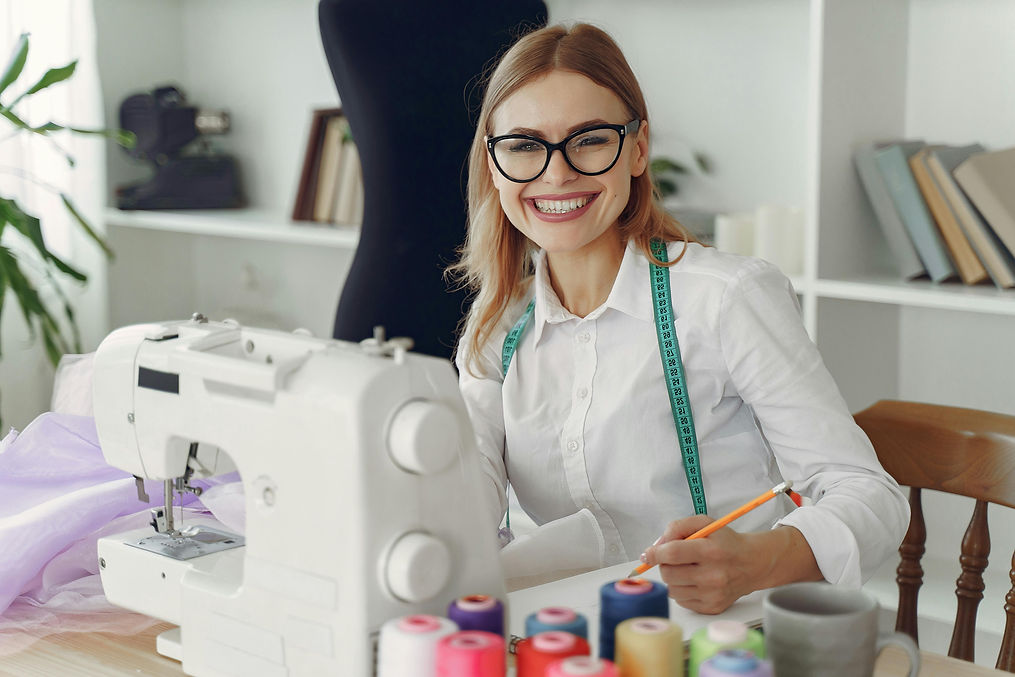 dress maker at a desk 