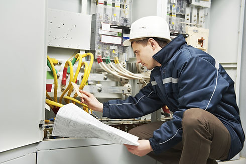 An expert working on a manufacturing machine