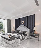 Luxurious master bedroom with dark navy upholstered wall, white bed, and marble floors