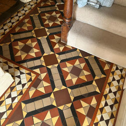 Repaired colorful geometric mosaic floor.