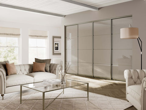 Modern living room featuring integrated grey sliding storage doors