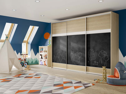 Large black sliding wardrobes with wood framing in a child's playroom