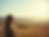 A serene landscape-photography shot showing a calm person looking towards a horizon with s