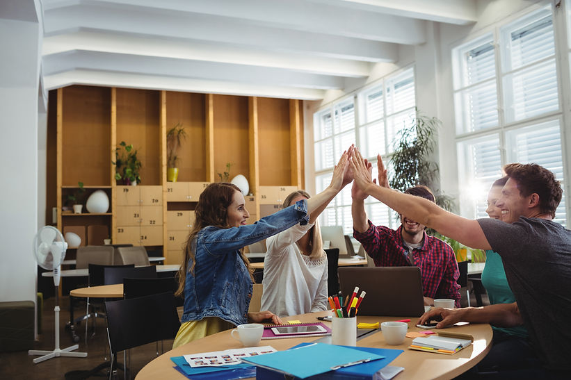 creative-business-team-putting-hands-together.jpg