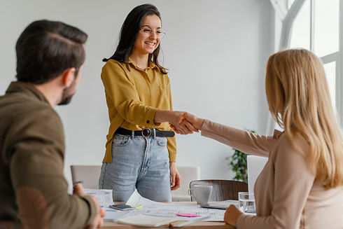 businesswomen-shaking-hands-at-work.jpg