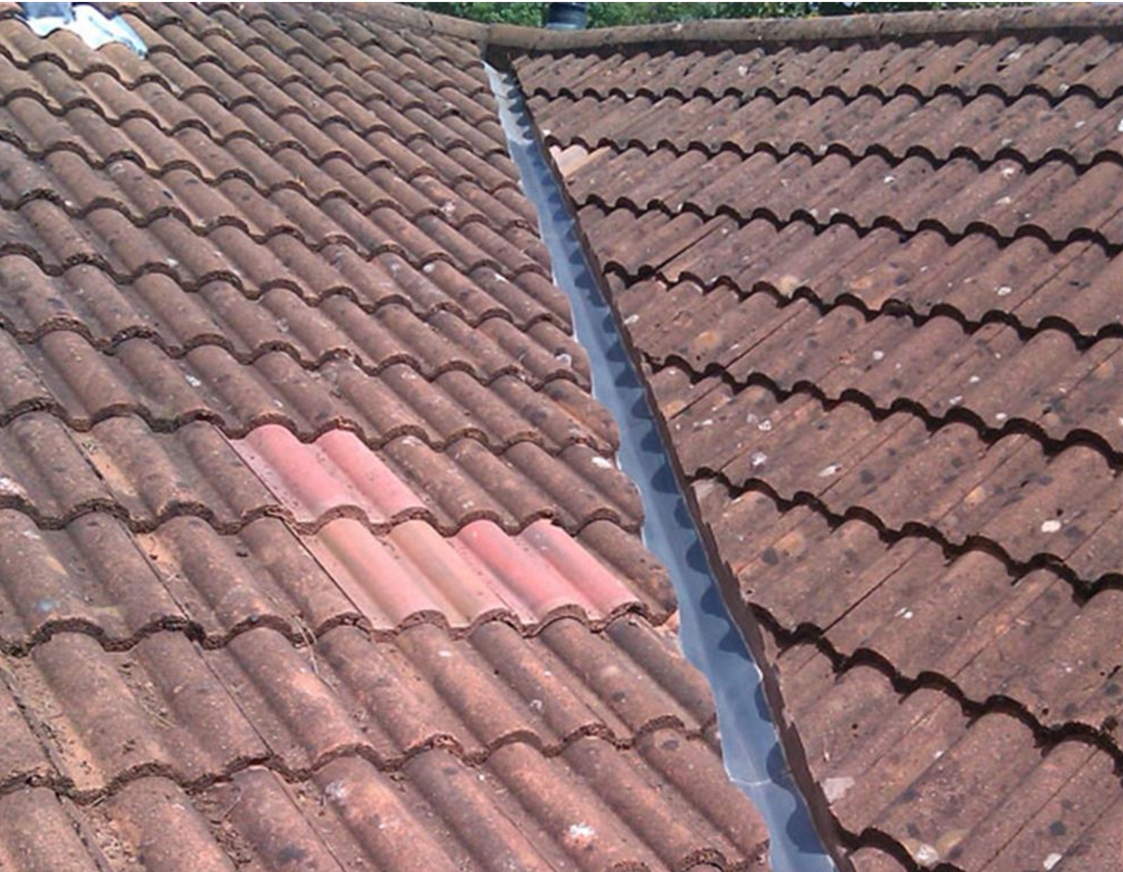 Roof valley collecting debris and moisture causing deterioration