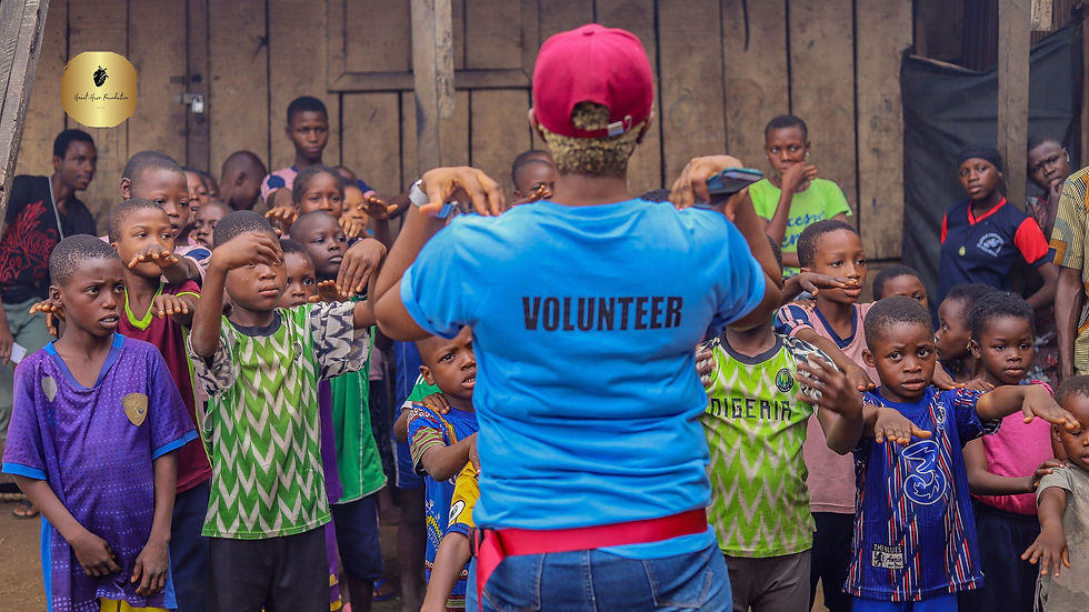 Woman volunteer standing in front of African kids in their community.