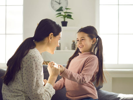 Happy Smiling Mother Holding Daughter Hand Talking to Child Giving Support.