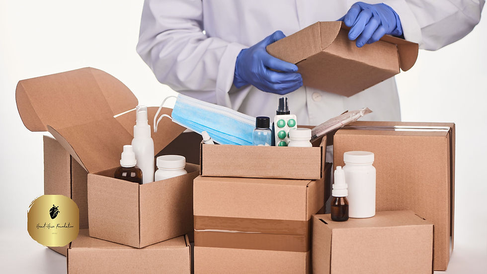 A medical personnel packing medications and supplies into boxes.