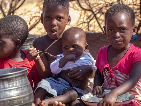 African children eating.