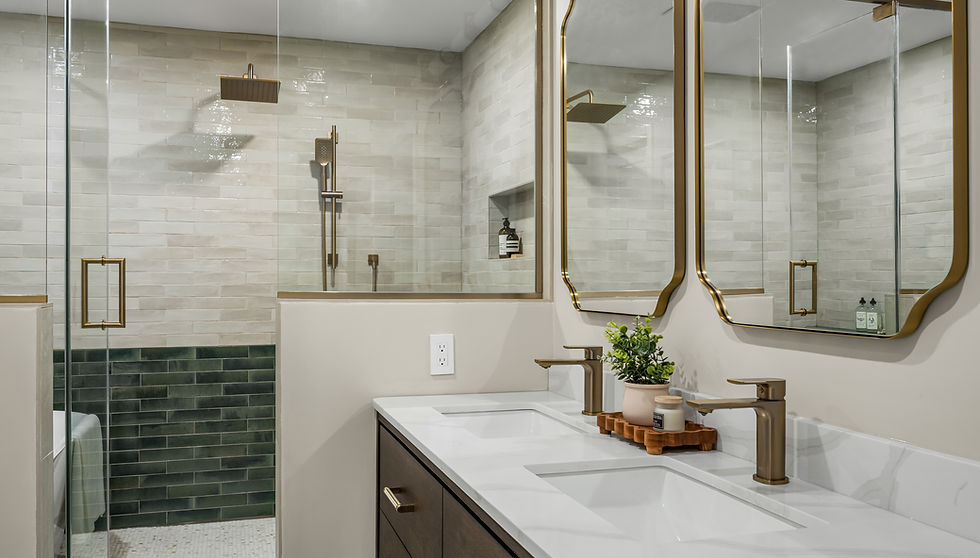 Luxury bathroom renovation in Hampstead featuring a wet room shower, heated penny round flooring, freestanding tub, double vanity, custom glass enclosure, and two-tone tile detailing.