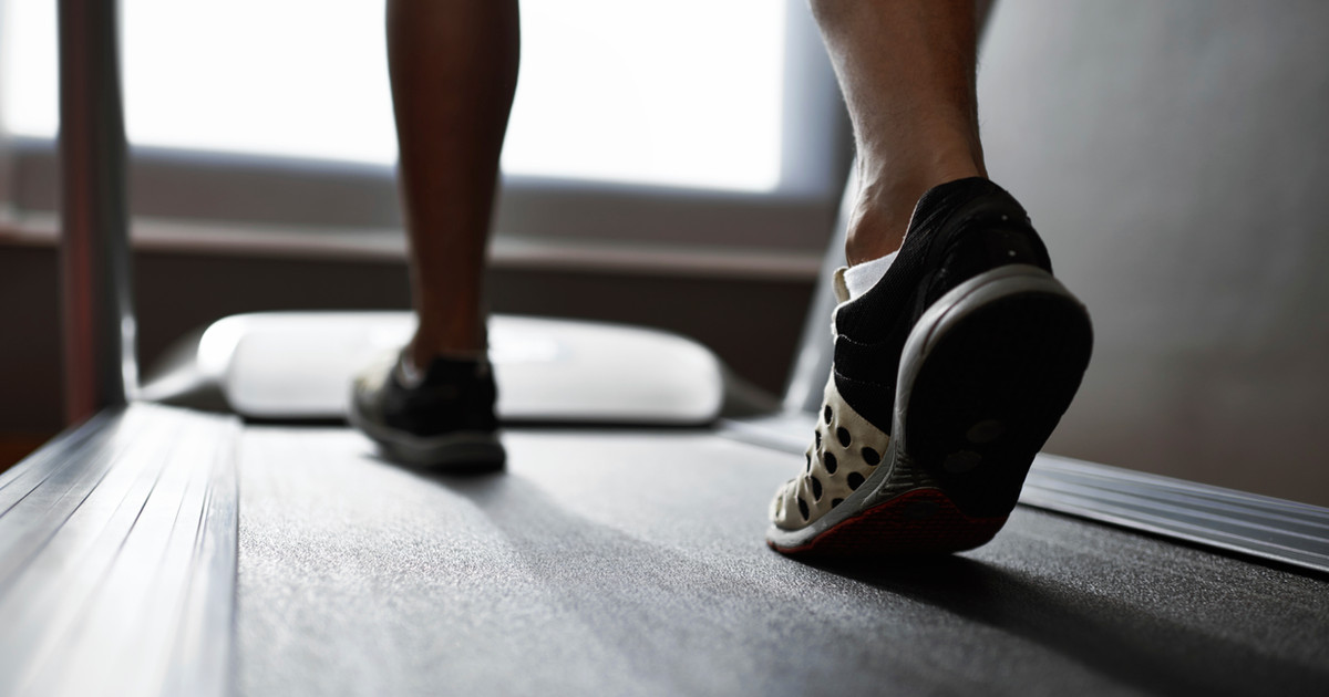 A person beginning a gentle walking program with the support of a physiotherapist, illustrating the importance of starting gradually and building confidence over time.