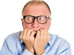 A man biting all his nails.