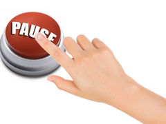 Drawing of hand with finder on the pause button