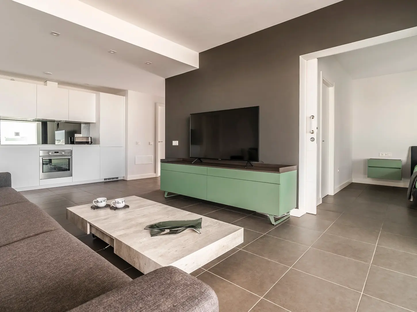 Contemporary living room with sofa, TV cabinet and neutral palette