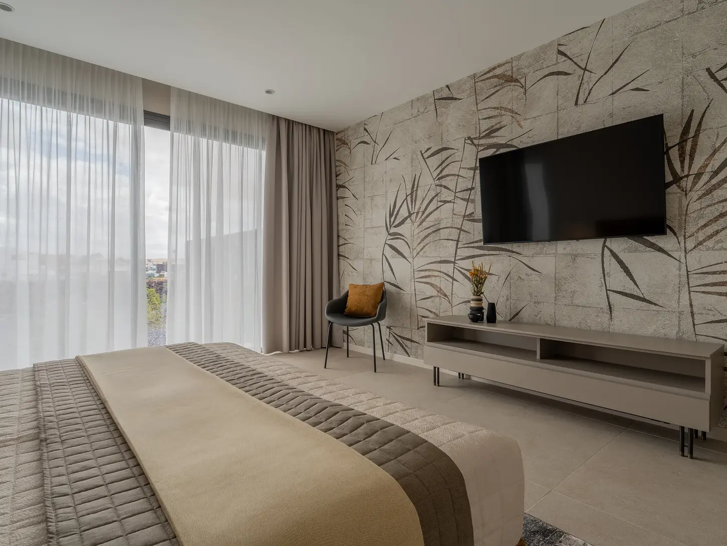 Room with decorative wall and TV area