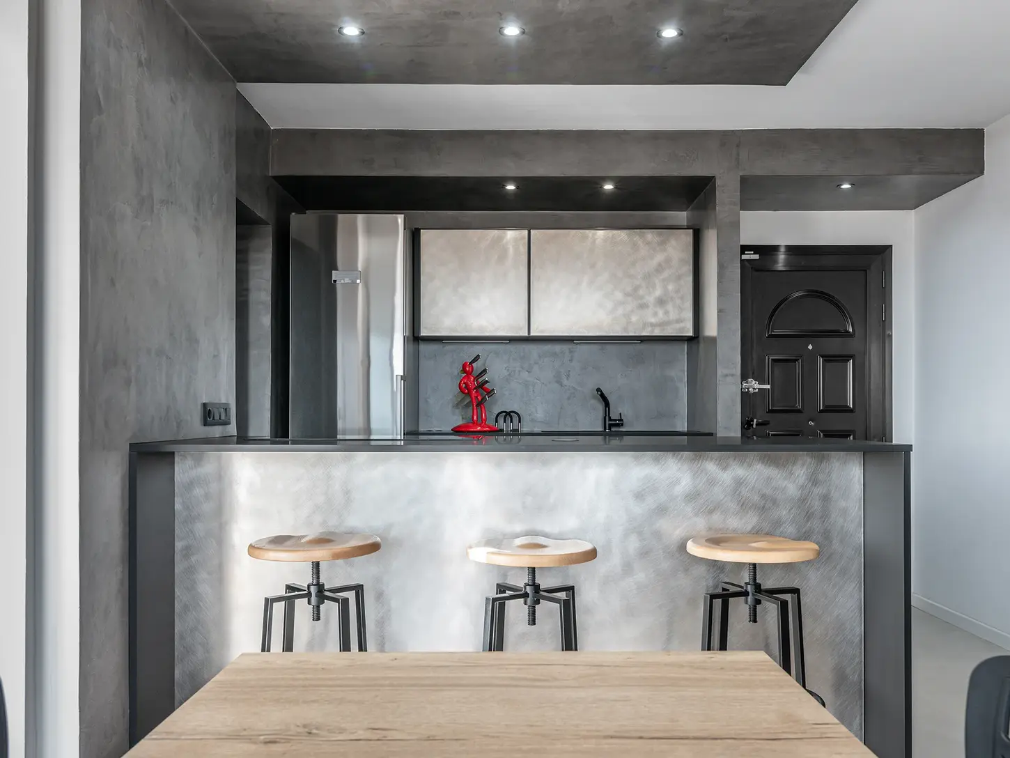 Kitchen with contemporary-style counter and stools