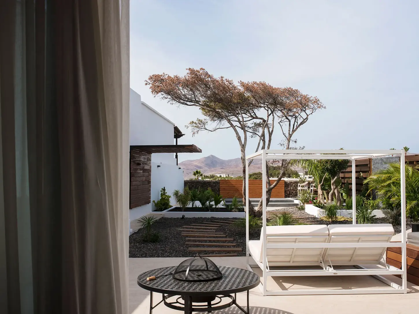 Outdoor double daybed with garden view