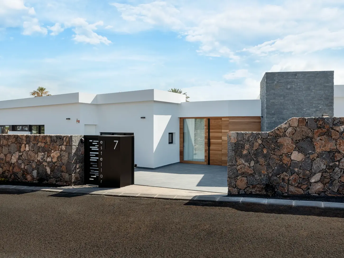 Entrance to the villa with modern architecture and contrasting materials
