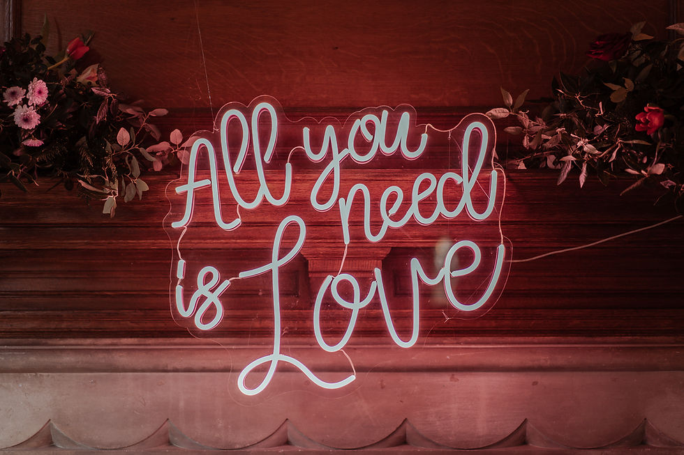All You Need is Love neon sign on fire mantel piece at Balcombe Place