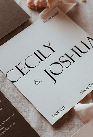 White wedding invitation with bold typography hot foiled in black for a luxurious feel