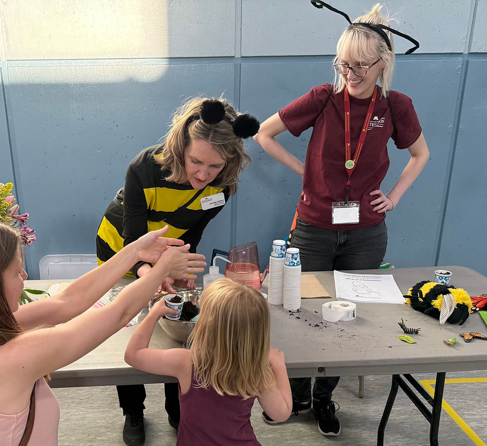 Jen Nelson and Abbie Hanson spread the word about pollinators at the RGEV Youth Projects table for children at the Linwood Recreation Center Spring Fling in St.Paul