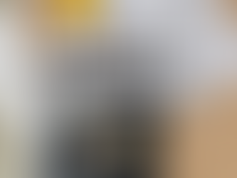 A photo of police paperwork and a police officer's badge with a black mourning band.