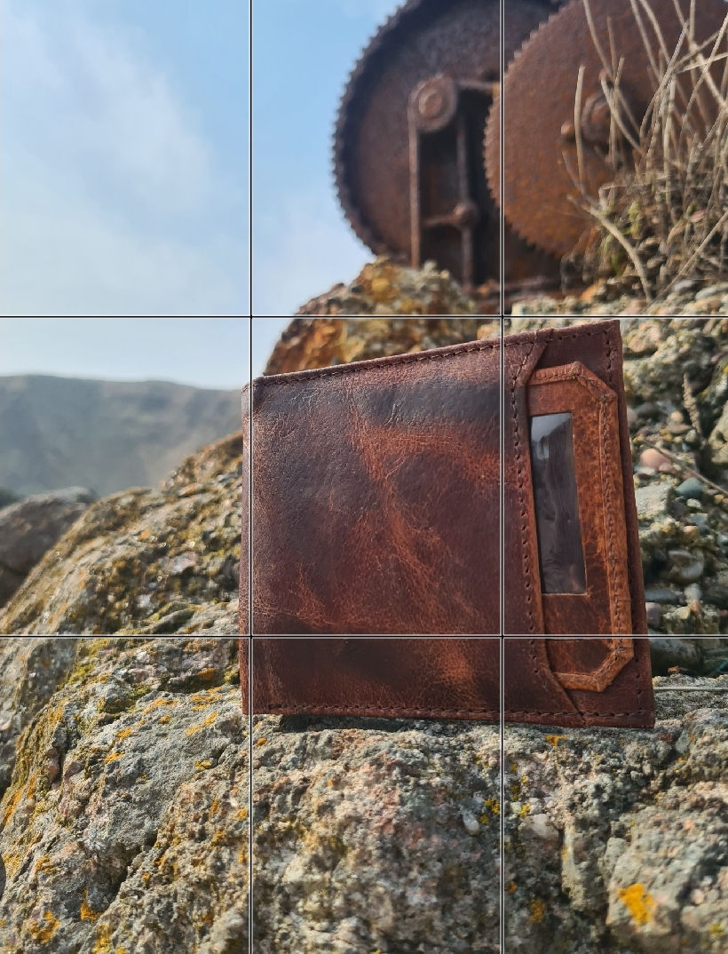 Thumbnail: picture of a leather wallet on thenorth east coast of scotland small local buiness shown on a rock at the harbour