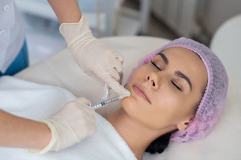 young-woman-getting-facial-procedure-clinic.jpg