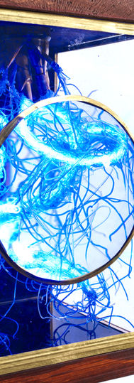 LED filament detail thru viewing lens. Brass, acrylic, bamboo and reclaimed wood.