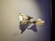 fine art gallery opening, natural and brass floor lamp and wall sconces, white glass, refined art deco, mid century modern